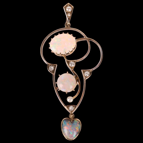 1101 - An Antique Edwardian 14ct gold opal pearl and diamond openwork pendant, set with vari-cut opals comp... 