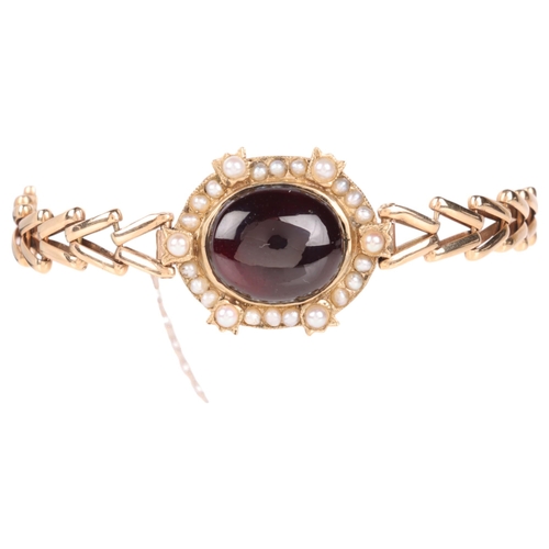 1118 - An Antique 9ct gold garnet and pearl cluster mourning bracelet, circa 1880, the central foil-back ov... 