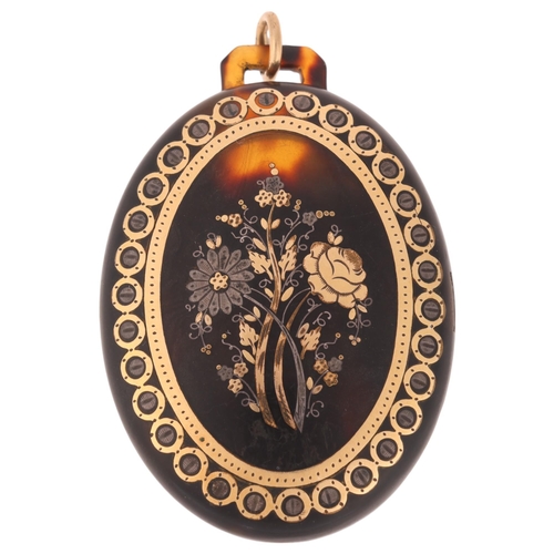 1122 - An Antique Victorian tortoiseshell locket pendant, the front panel pique inlaid with gold and silver... 