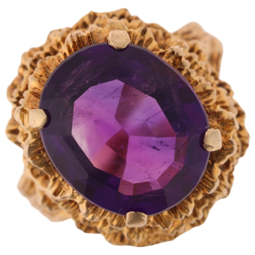 1127 - A Vintage 9ct gold single stone amethyst abstract ring, maker HB, London 1967, set with oval-cut ame... 