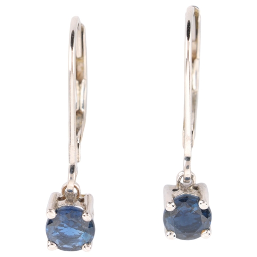 1130 - A pair of 18ct white gold single stone sapphire drop earrings, each set with round-cut sapphire with... 