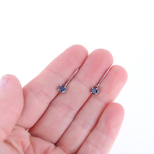 1130 - A pair of 18ct white gold single stone sapphire drop earrings, each set with round-cut sapphire with... 