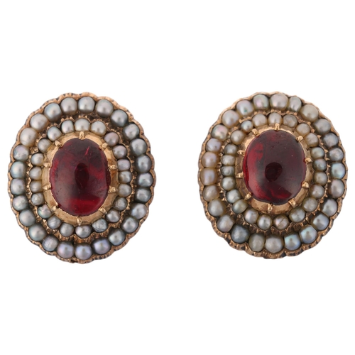 1134 - A pair of Victorian garnet and split pearl mourning earrings, each cut-down collet set with foil-bac... 