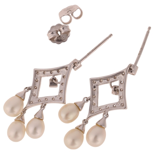 1138 - A pair of 18ct white gold pearl and diamond drop stud earrings, each lozenge set with modern round b... 