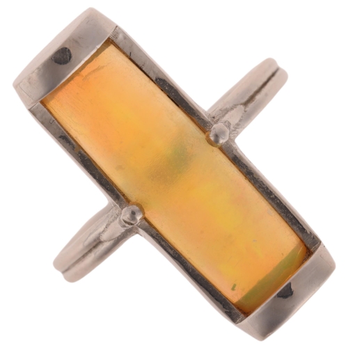 1142 - A platinum opal dress ring, maker JC, set with semi-cylinder opal, setting height 22.6mm, size N, 6.... 