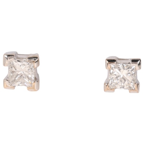 1143 - A pair of 18ct two-colour gold 0.6ct single stone diamond stud earrings, each set with 0.3ct Princes... 