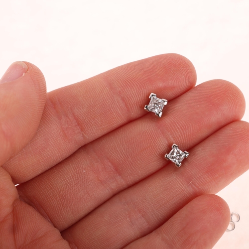 1143 - A pair of 18ct two-colour gold 0.6ct single stone diamond stud earrings, each set with 0.3ct Princes... 