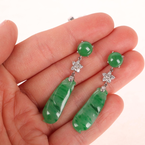 1145 - A pair of 18ct white gold jade and diamond drop stud earrings, each set with round cabochon jade sus... 