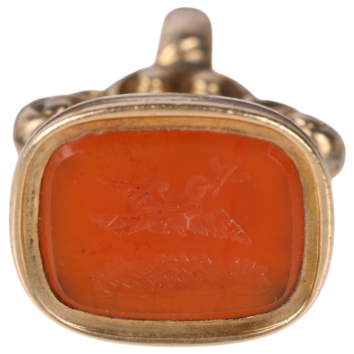 1155 - An Antique Victorian miniature carnelian seal fob, the carnelian intaglio carved with dove in flight... 