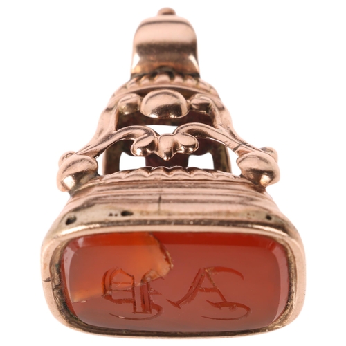 1156 - A large Antique Victorian 9ct rose gold carnelian seal fob, the carnelian intaglio carved with initi... 