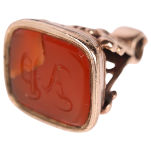 1156 - A large Antique Victorian 9ct rose gold carnelian seal fob, the carnelian intaglio carved with initi... 