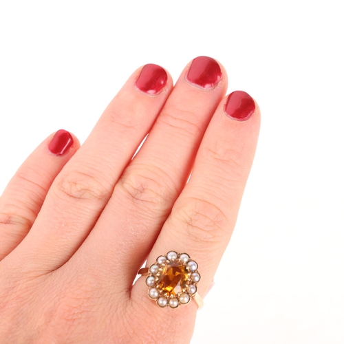 1165 - An Antique 9ct gold citrine and split pearl flowerhead cluster ring, set with oval mixed-cut citrine... 