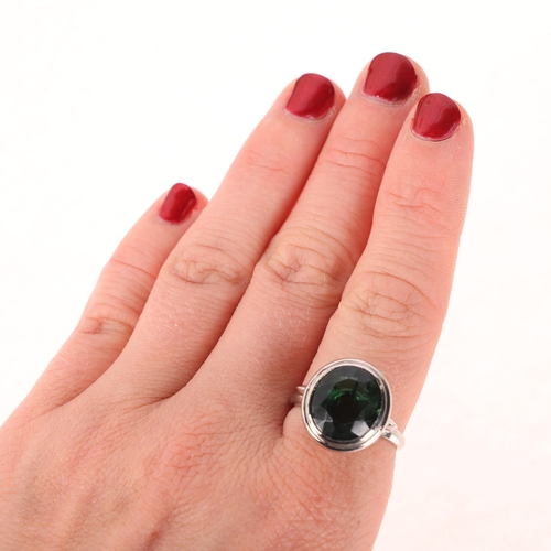 1169 - A platinum prasiolite dress ring, rub-over set with oval mixed-cut prasiolite, setting height 16.4mm... 