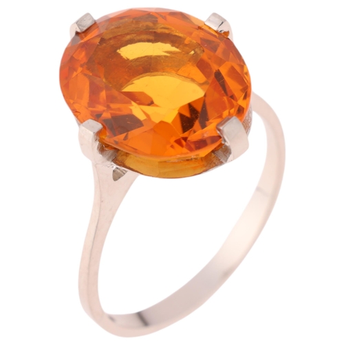 1171 - A platinum single stone citrine dress ring, set with oval mixed-cut citrine, setting height 16mm, si... 