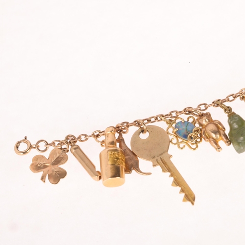 1181 - A 9ct gold cable link charm bracelet, with 14 x 9ct charms, 18cm, 16g gross