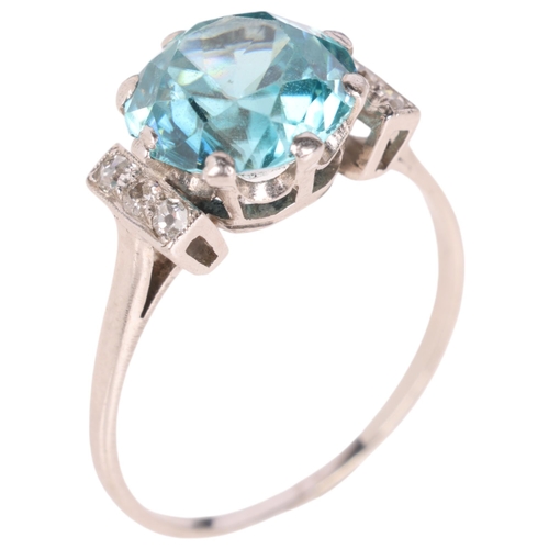 1193 - An Art Deco 9ct white gold blue zircon and diamond dress ring, claw set with round-cut zircon flanke... 