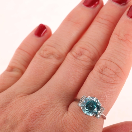 1193 - An Art Deco 9ct white gold blue zircon and diamond dress ring, claw set with round-cut zircon flanke... 