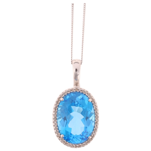 1194 - A 9ct white gold blue topaz and diamond oval cluster pendant necklace, set with oval mixed-cut topaz... 