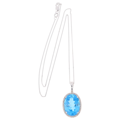 1194 - A 9ct white gold blue topaz and diamond oval cluster pendant necklace, set with oval mixed-cut topaz... 