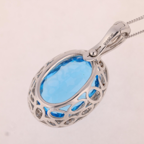 1194 - A 9ct white gold blue topaz and diamond oval cluster pendant necklace, set with oval mixed-cut topaz... 