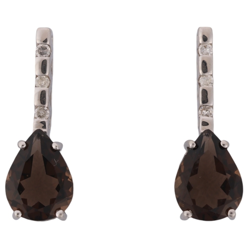 1199 - A pair of 9ct white gold smoky quartz and diamond stud earrings, set with pear-cut smoky quartz and ... 