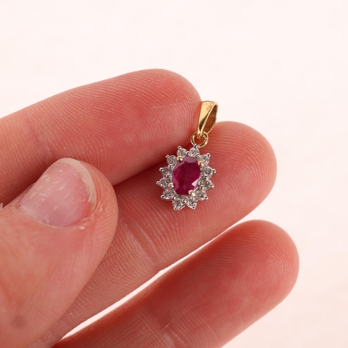 1204 - An 18ct gold ruby and diamond flowerhead cluster pendant, set with oval mixed-cut ruby and modern ro... 