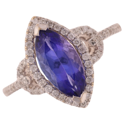 1207 - An 18ct white gold tanzanite and diamond marquise halo cluster ring, set with 1.68ct marquise-cut tr... 