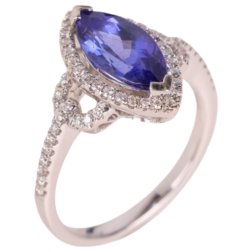 1207 - An 18ct white gold tanzanite and diamond marquise halo cluster ring, set with 1.68ct marquise-cut tr... 