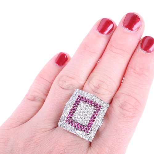 1211 - A large 9ct white gold ruby and diamond cluster panel ring, each wavy rectangular panel pave set wit... 