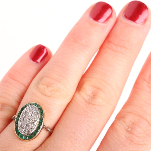 1226 - An Art Deco platinum emerald and diamond panel ring, the oval panel pave set with old-cut diamonds s... 