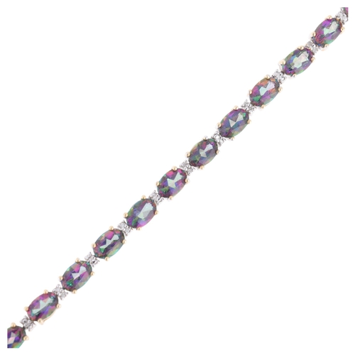 1239 - A modern 9ct gold mystic topaz diamond tennis line bracelet, 19cm, 10g