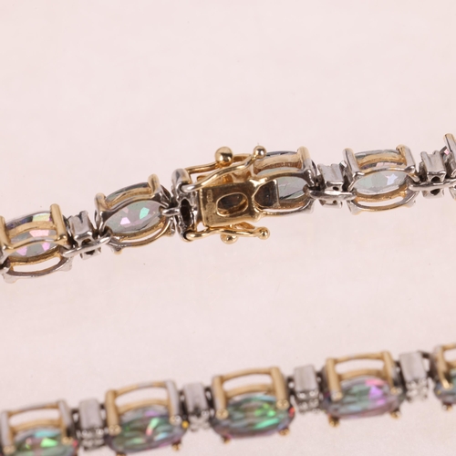 1239 - A modern 9ct gold mystic topaz diamond tennis line bracelet, 19cm, 10g