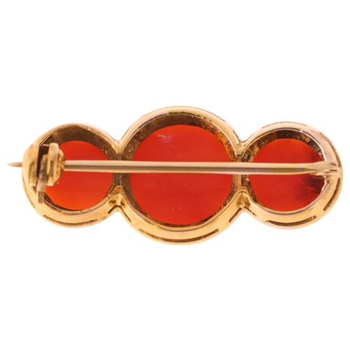 1244 - A 9ct gold three stone button coral brooch, unmarked mount tests as 9ct gold 30.5mm, 4.2g