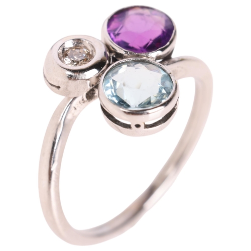 1245 - An 18ct white gold gem set dress ring, set with amethyst blue topaz and diamond, setting height 11.7... 