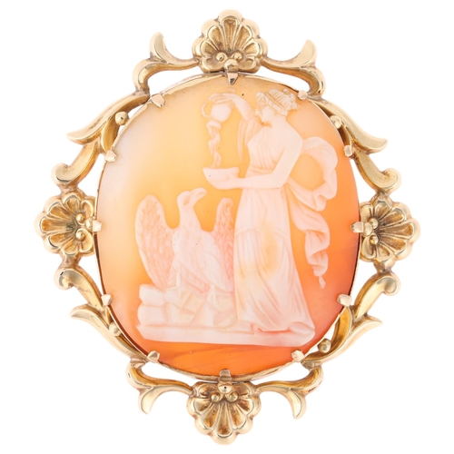 1252 - A 19th century 9ct gold shell cameo brooch, relief carved depicting Hebe feeding eagle Zeus, within ... 