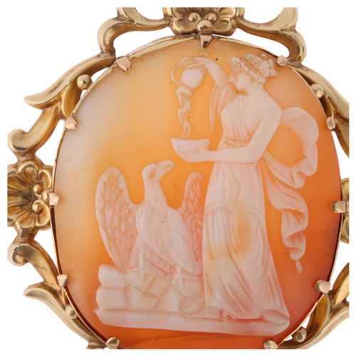 1252 - A 19th century 9ct gold shell cameo brooch, relief carved depicting Hebe feeding eagle Zeus, within ... 