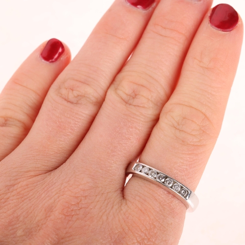 1254 - An 18ct white gold diamond quarter eternity ring, by Iliana, channel set with modern round brilliant... 