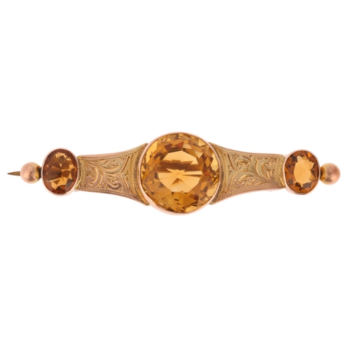 1259 - An Antique 9ct rose gold citrine brooch, set with round and oval-cut citrines with foliate engraved ... 