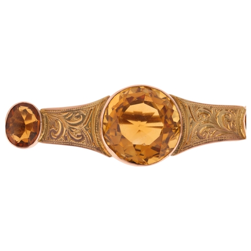 1259 - An Antique 9ct rose gold citrine brooch, set with round and oval-cut citrines with foliate engraved ... 