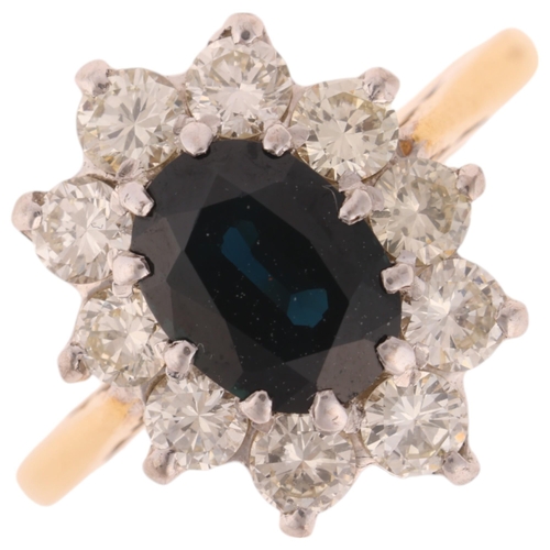 1262 - An 18ct gold sapphire and diamond flowerhead cluster ring, set with oval mixed-cut sapphire and mode... 