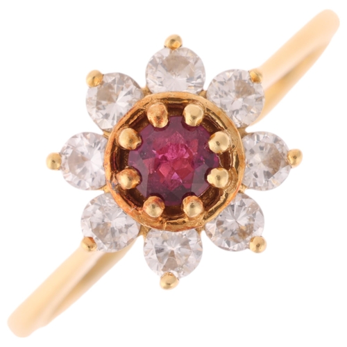 1270 - An 18ct gold ruby and diamond flowerhead cluster ring, set with round-cut ruby and modern round bril... 