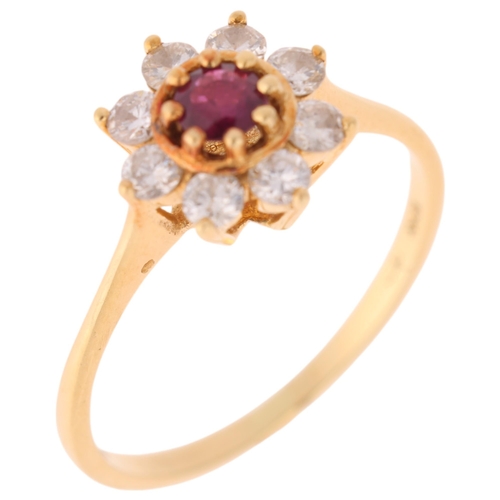 1270 - An 18ct gold ruby and diamond flowerhead cluster ring, set with round-cut ruby and modern round bril... 