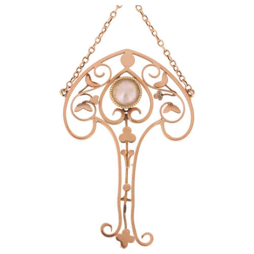 1272 - An Art Nouveau Edwardian 9ct rose gold blister pearl openwork lavaliere pendant, circa 1905, the clu... 