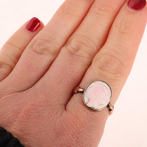 1275 - A 9ct rose gold pink conch shell cameo ring, relief carved depicting female profile, setting height ... 