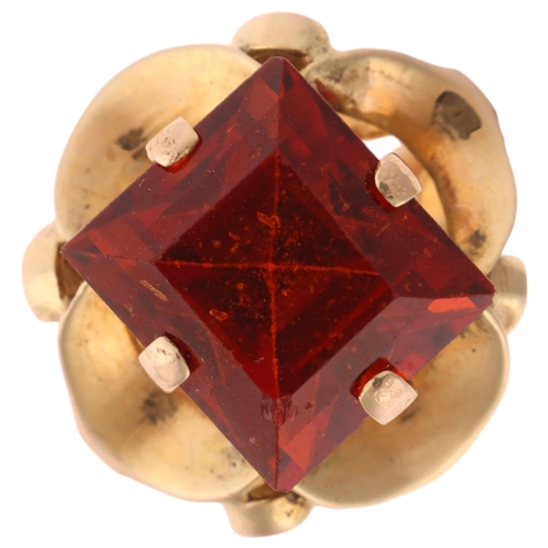 1280 - A 9ct gold orange hessonite garnet dress ring, set with rectangular step-cut garnet, unmarked mount ... 