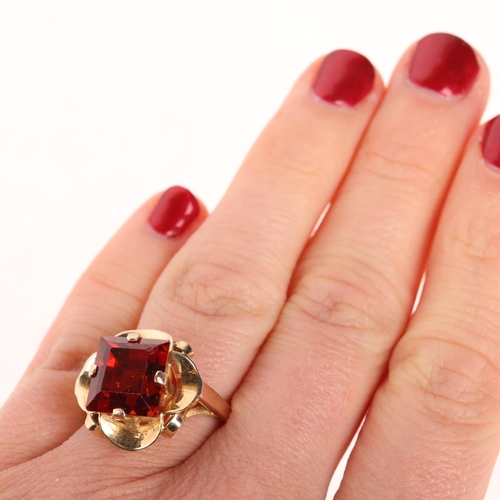 1280 - A 9ct gold orange hessonite garnet dress ring, set with rectangular step-cut garnet, unmarked mount ... 