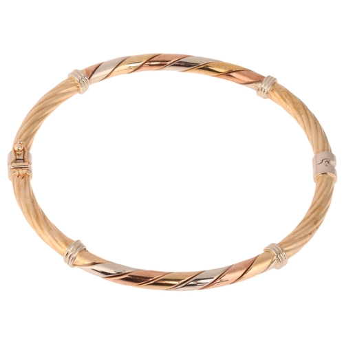 1296 - A 9ct three-colour gold hinged bangle, hallmarks 1996, band width 4.1mm, internal circumference 18cm... 