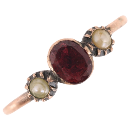 1297 - A Georgian 9ct gold three stone garnet and pearl ring, cut-down collet set with foil back oval-cut g... 