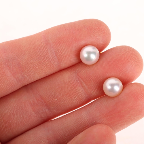 1306 - A pair of Japanese 14ct gold cultured pearl stud earrings, each set with 7.3mm pearl, 1.9g