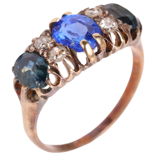 1312 - An 18ct gold seven stone sapphire and diamond half hoop ring, centrally set with oval mixed-cut coru... 